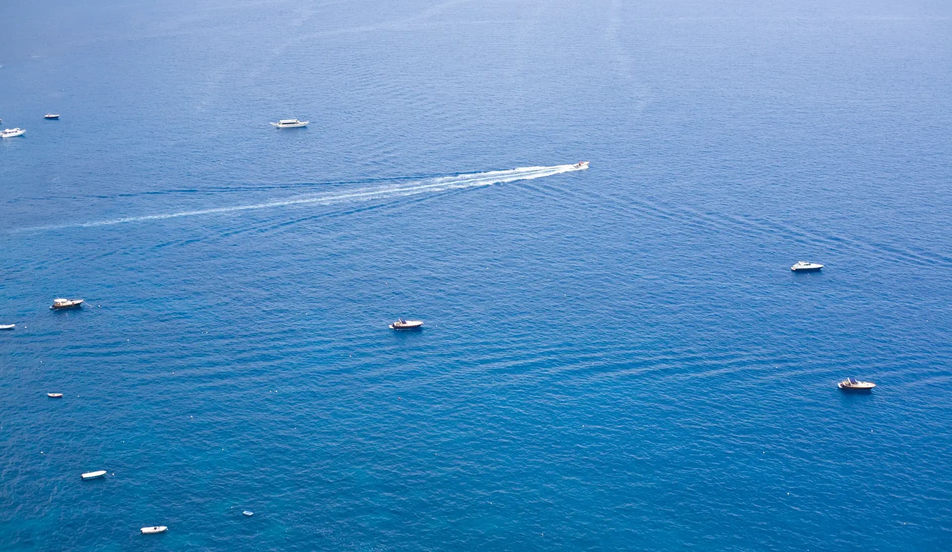 The Amalfi Coast falling away into the sea, seen from the cliffs above Positano